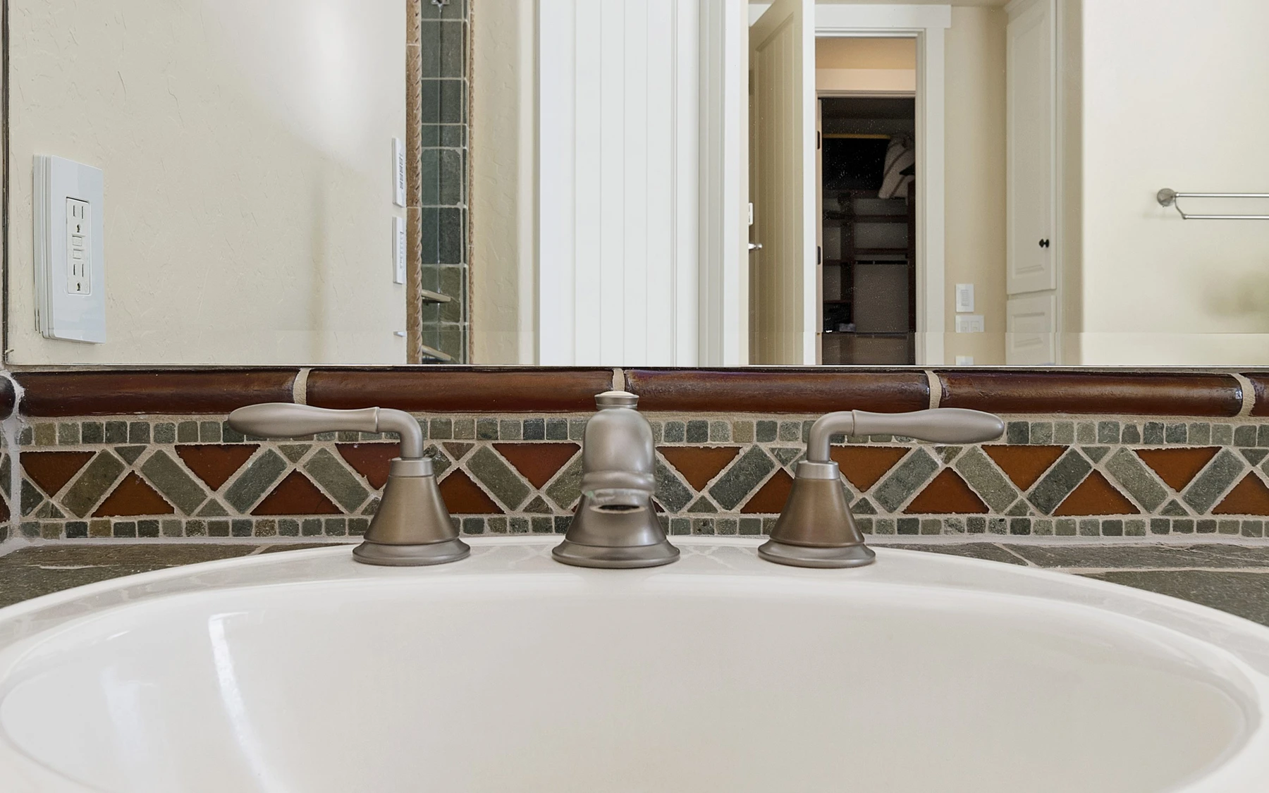 Bathroom in the Club Hill Refresh remodel at Whitetail Club, with a soaking tub and a custom vanity.