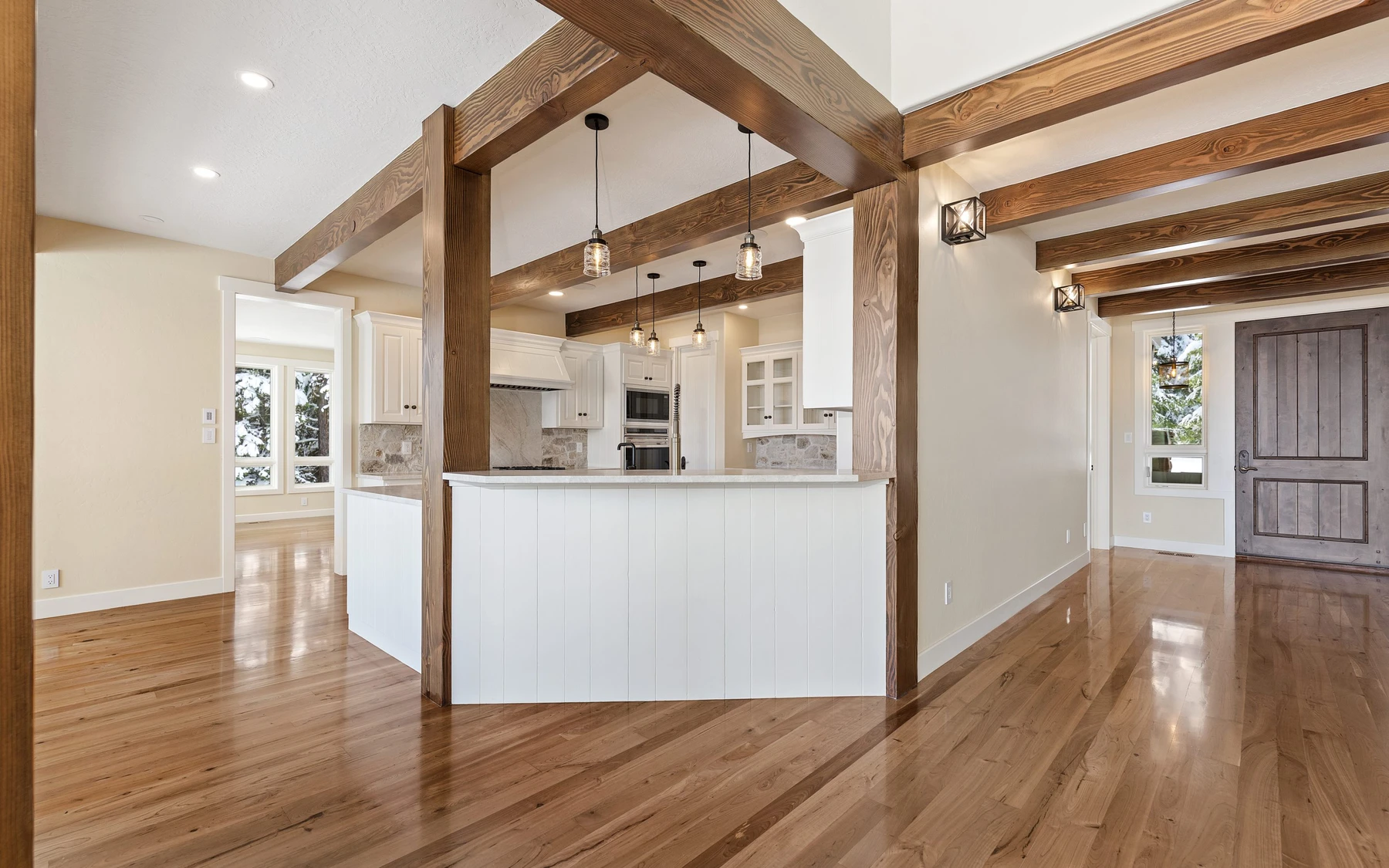 Interior detail in the Club Hill Refresh remodel at Whitetail Club, showing built-in cabinetry, large windows, and wood finishes.