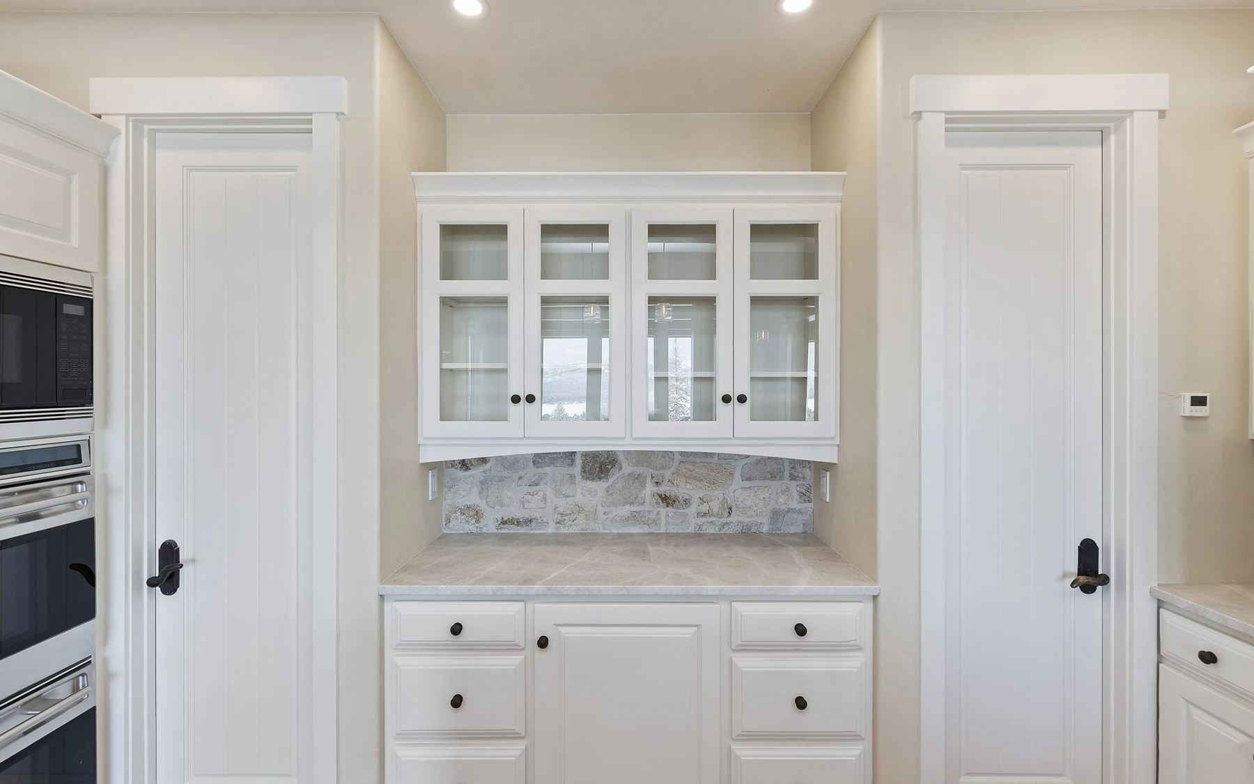 Interior detail in the Club Hill Refresh remodel at Whitetail Club, showing built-in cabinetry and large windows.