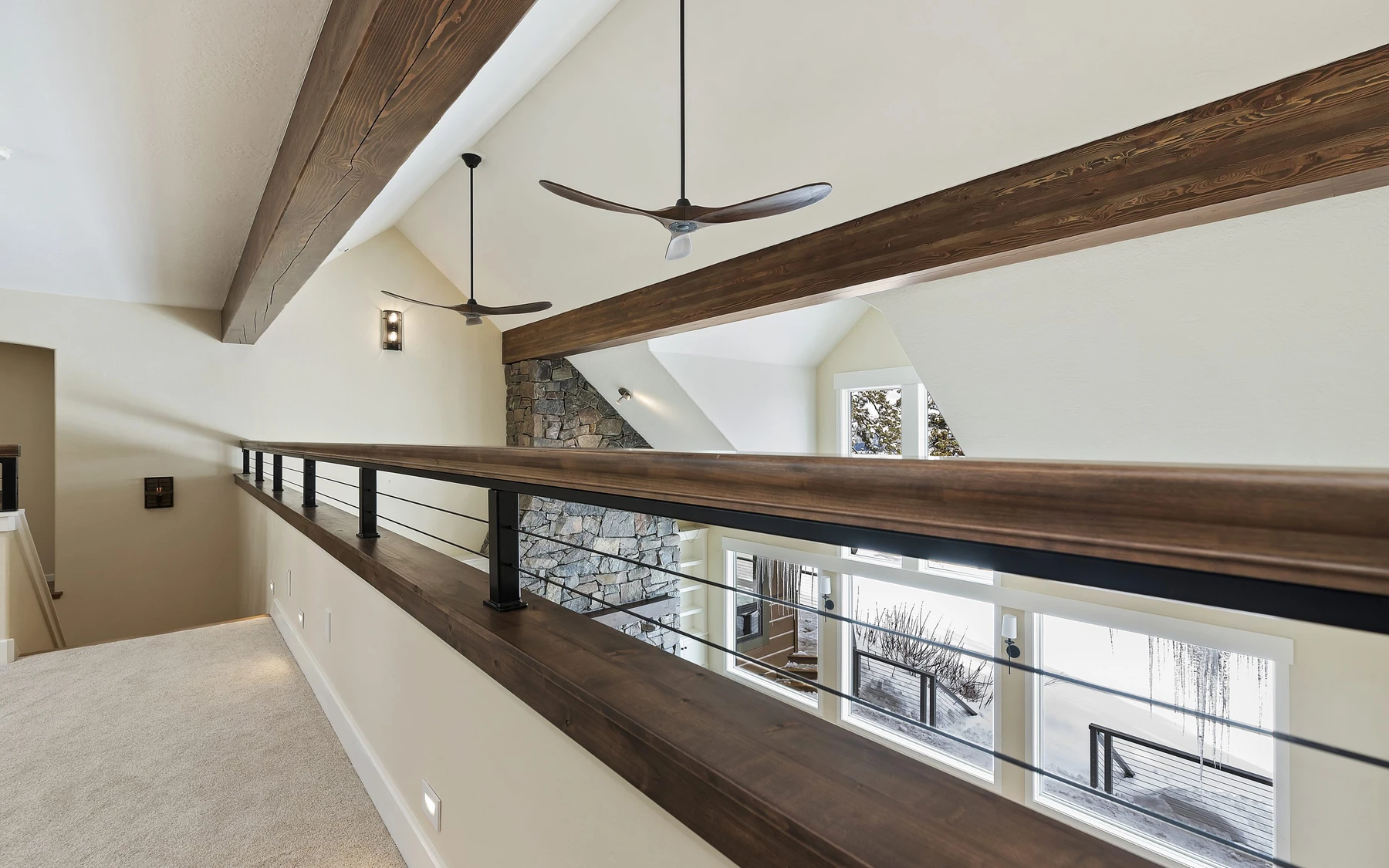 Interior detail in the Club Hill Refresh remodel at Whitetail Club, showing built-in cabinetry, large windows, and wood finishes.