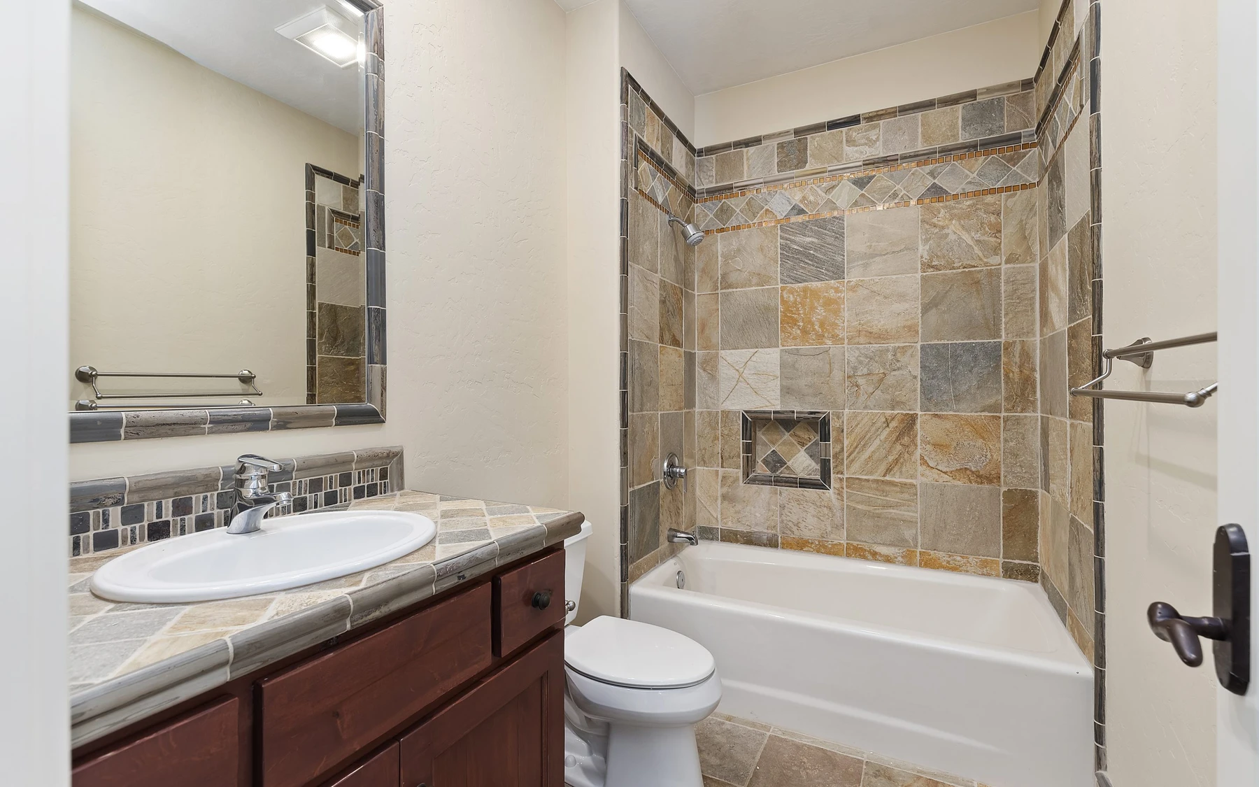Bathroom in the Club Hill Refresh remodel at Whitetail Club, with a soaking tub, a glass shower, and a custom vanity.