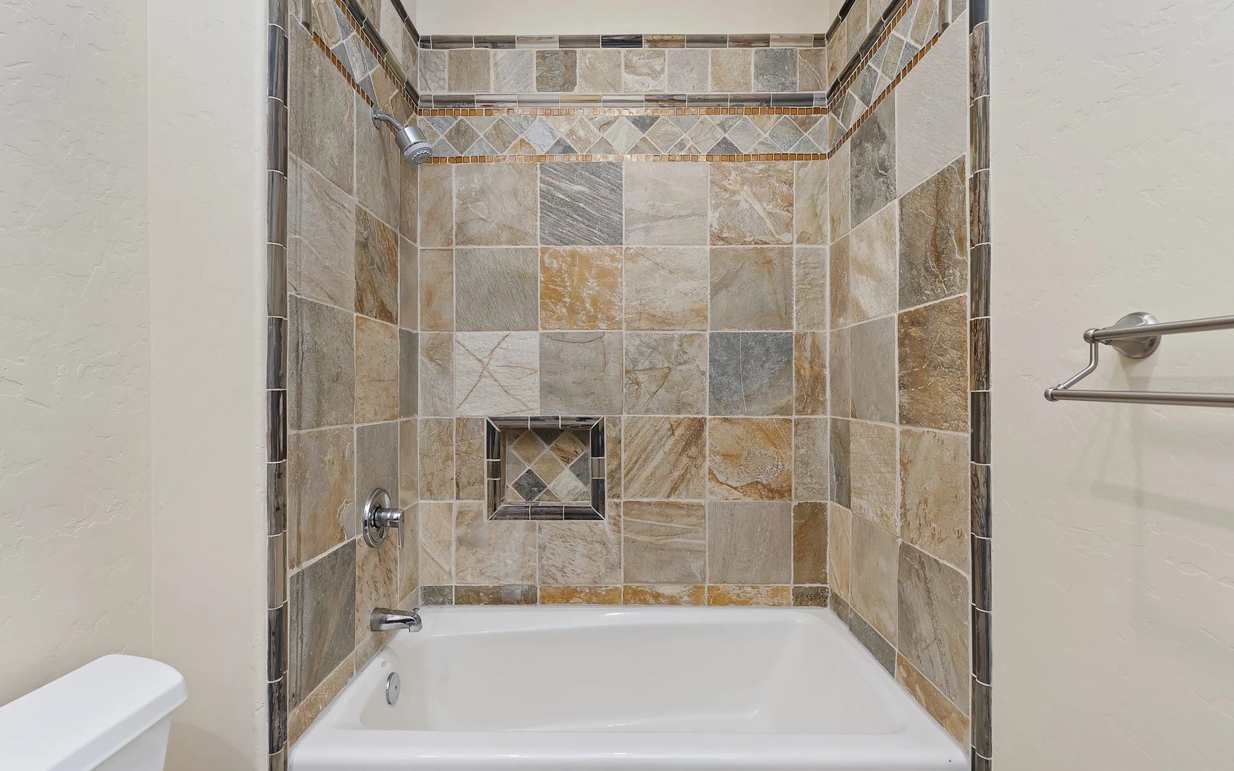 Bathroom in the Club Hill Refresh remodel at Whitetail Club, with a soaking tub, a glass shower, and a custom vanity.