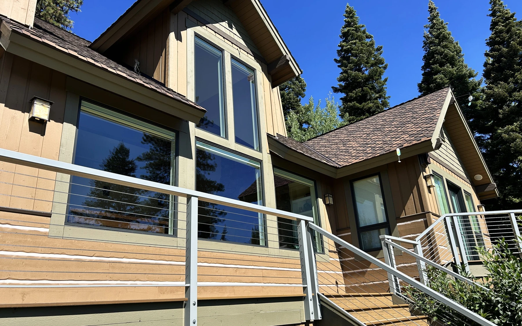 Covered outdoor space at the Club Hill Refresh remodel at Whitetail Club, with timber details and forest views.