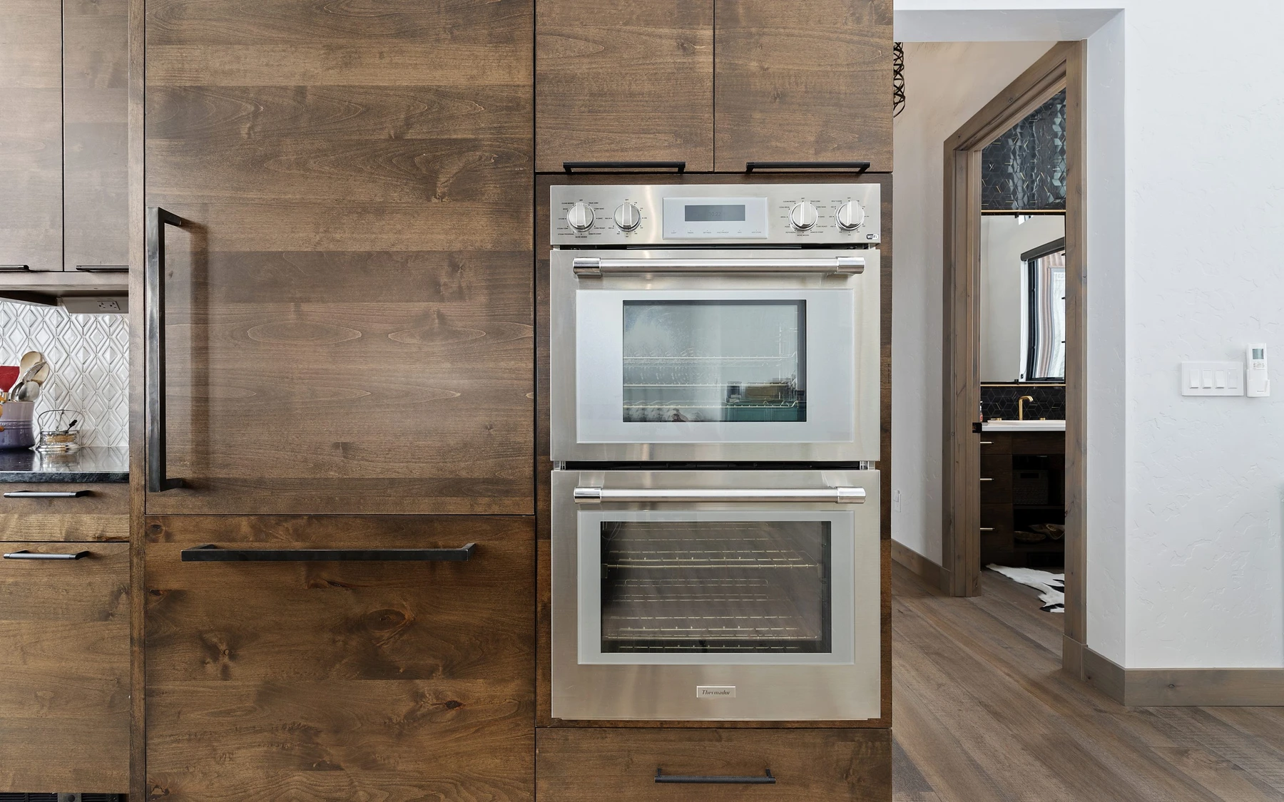 Interior detail in the Contemporary Hideaway custom home near McCall, showing built-in cabinetry and wood finishes.