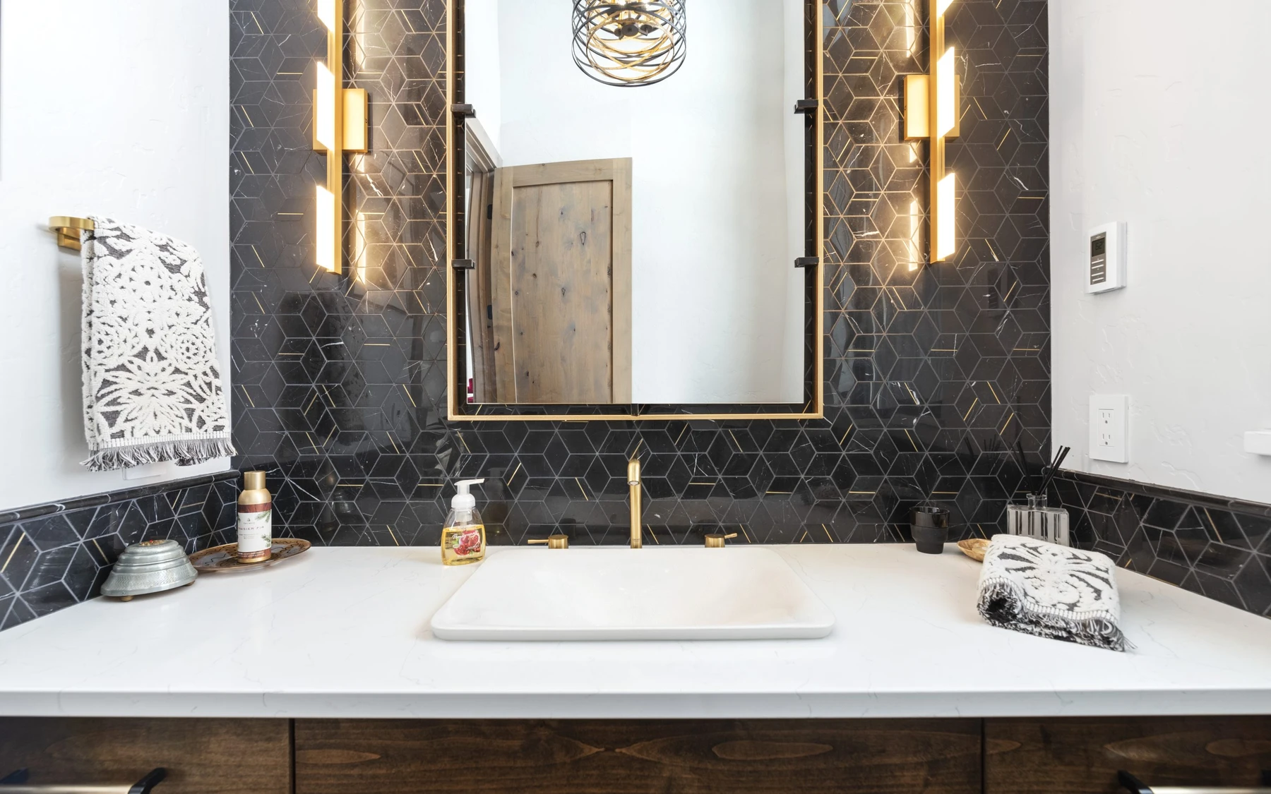 Bathroom in the Contemporary Hideaway custom home near McCall, with a custom vanity and wood cabinetry.