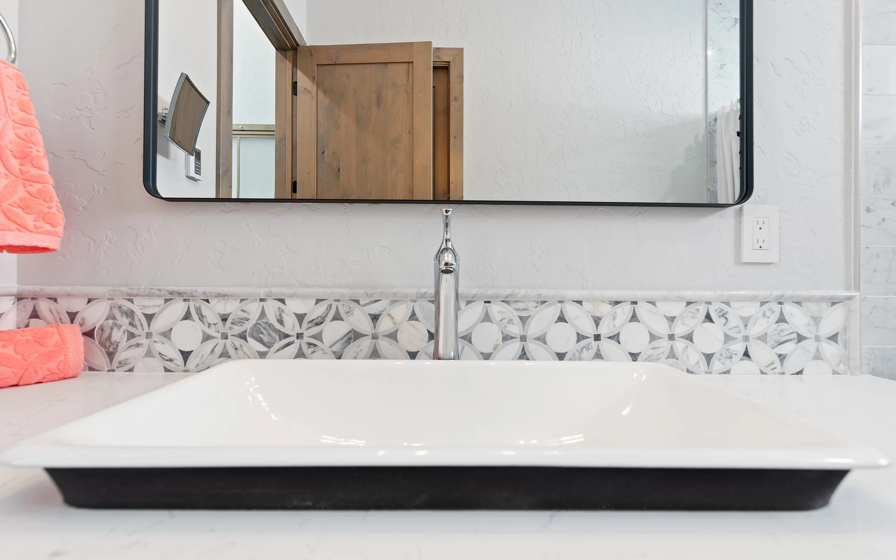 Bathroom in the Contemporary Hideaway custom home near McCall, with a custom vanity and wood cabinetry.