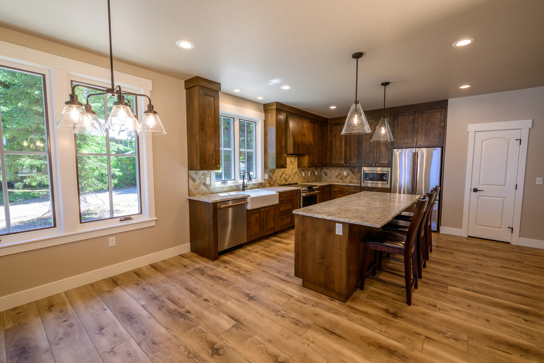 Pine Shore kitchen with wood cabinets, stainless appliances, and a compact work island