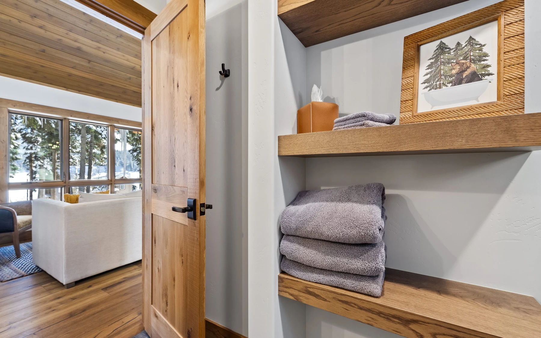 Interior detail in the Plymouth Retreat mountain home near McCall, showing built-in cabinetry, large windows, and wood finishes.