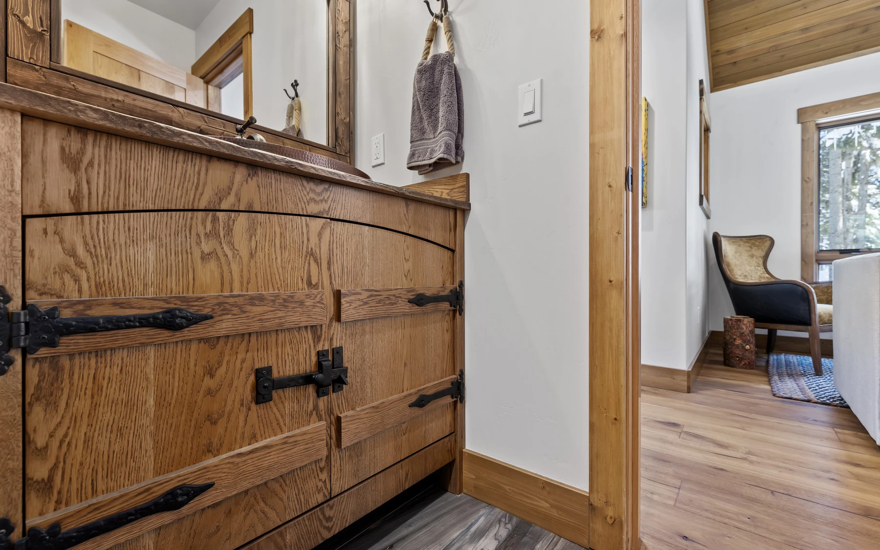 Interior detail in the Plymouth Retreat mountain home near McCall, showing built-in cabinetry, large windows, and wood finishes.