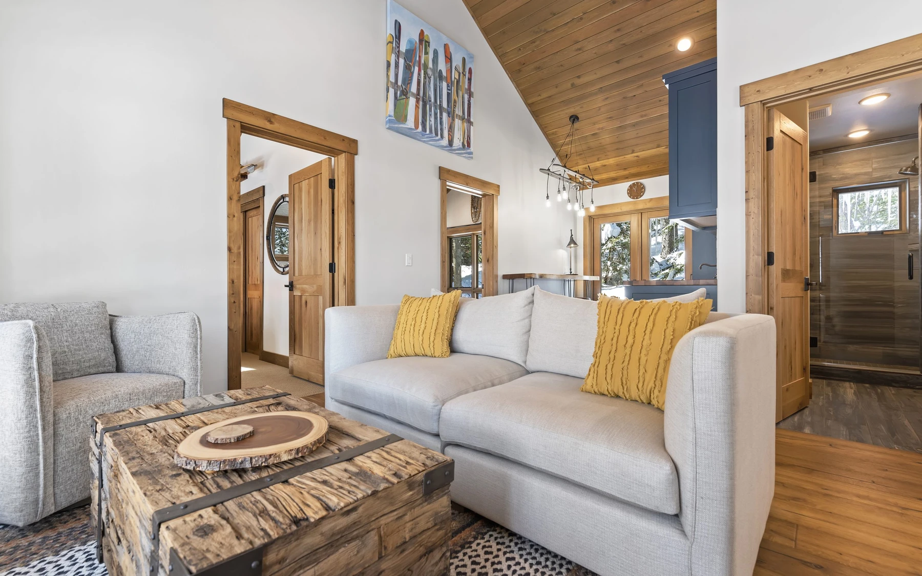 Living room in the Plymouth Retreat mountain home near McCall, with a relaxed seating area and warm wood finishes.