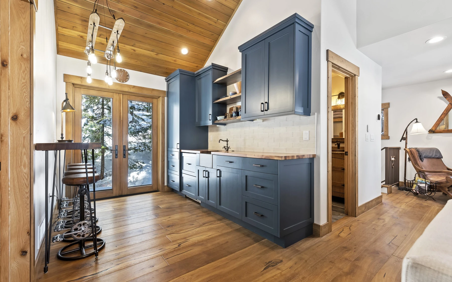 Interior detail in the Plymouth Retreat mountain home near McCall, showing built-in cabinetry, large windows, and wood finishes.