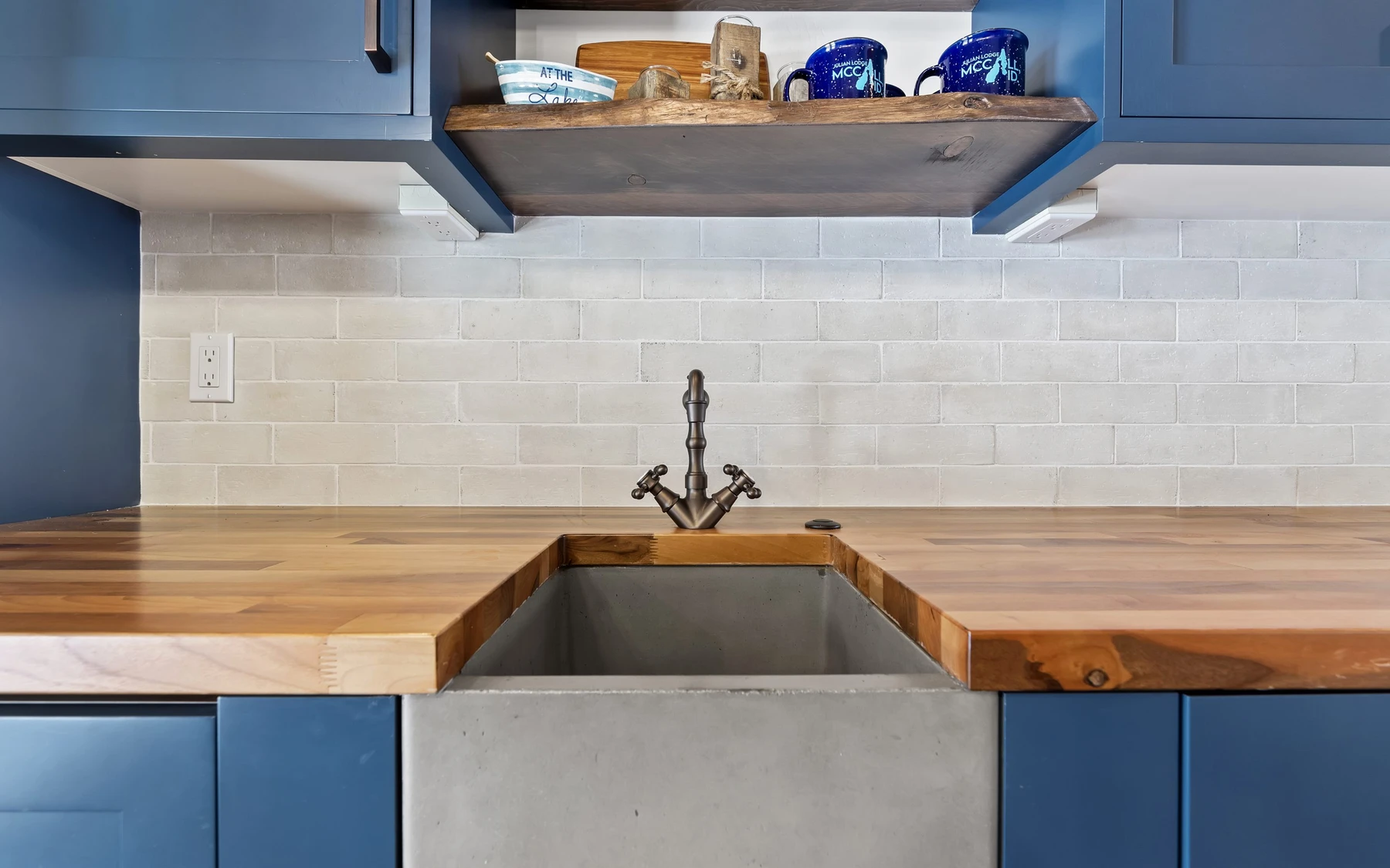 Interior detail in the Plymouth Retreat mountain home near McCall, showing built-in cabinetry, wood finishes, and stone details.