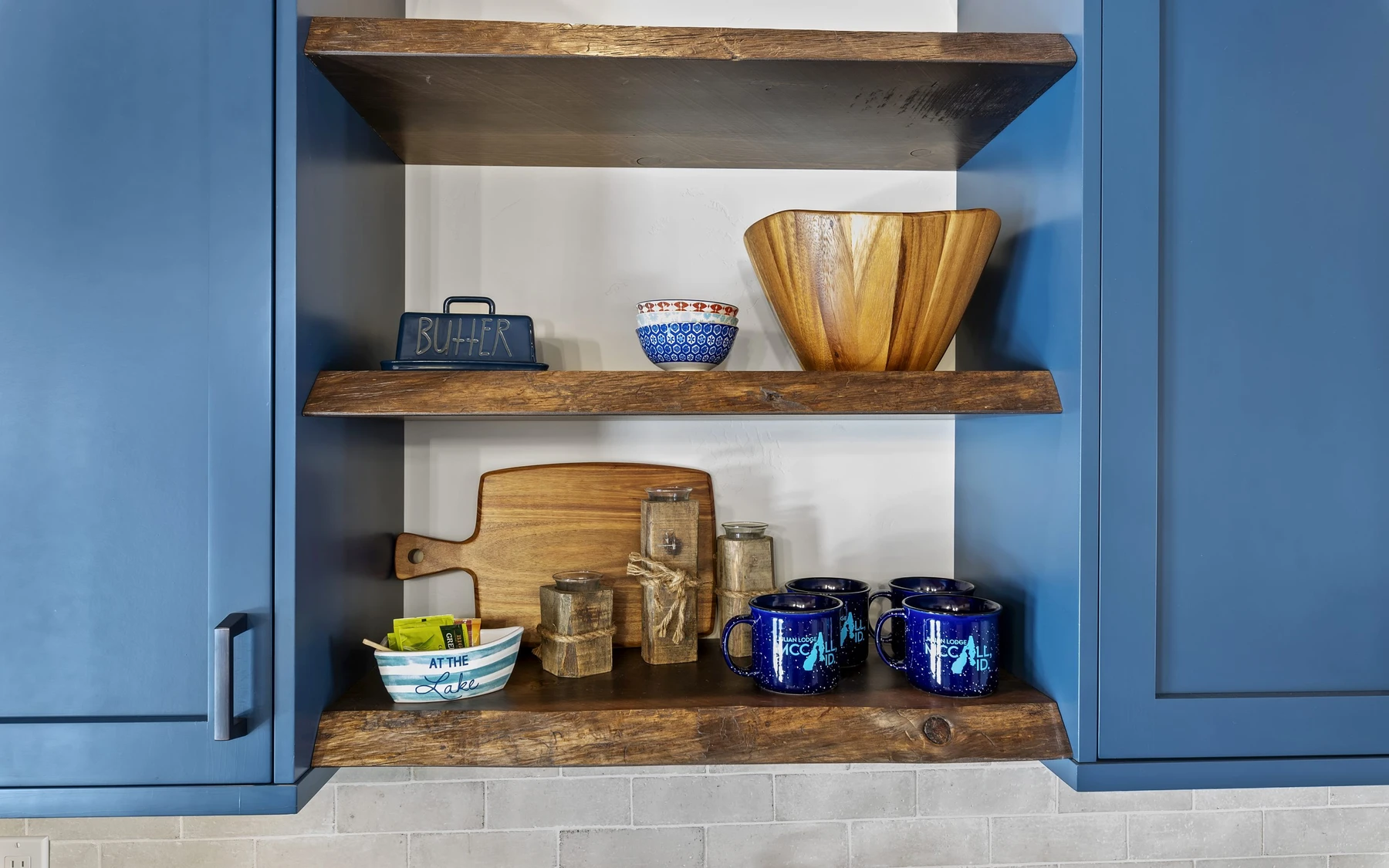Interior detail in the Plymouth Retreat mountain home near McCall, showing built-in cabinetry, wood finishes, and stone details.