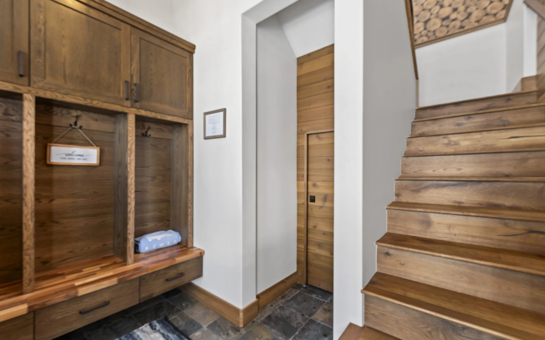 Dressing room in the Plymouth Retreat mountain home near McCall, with built-in storage and wood cabinetry.