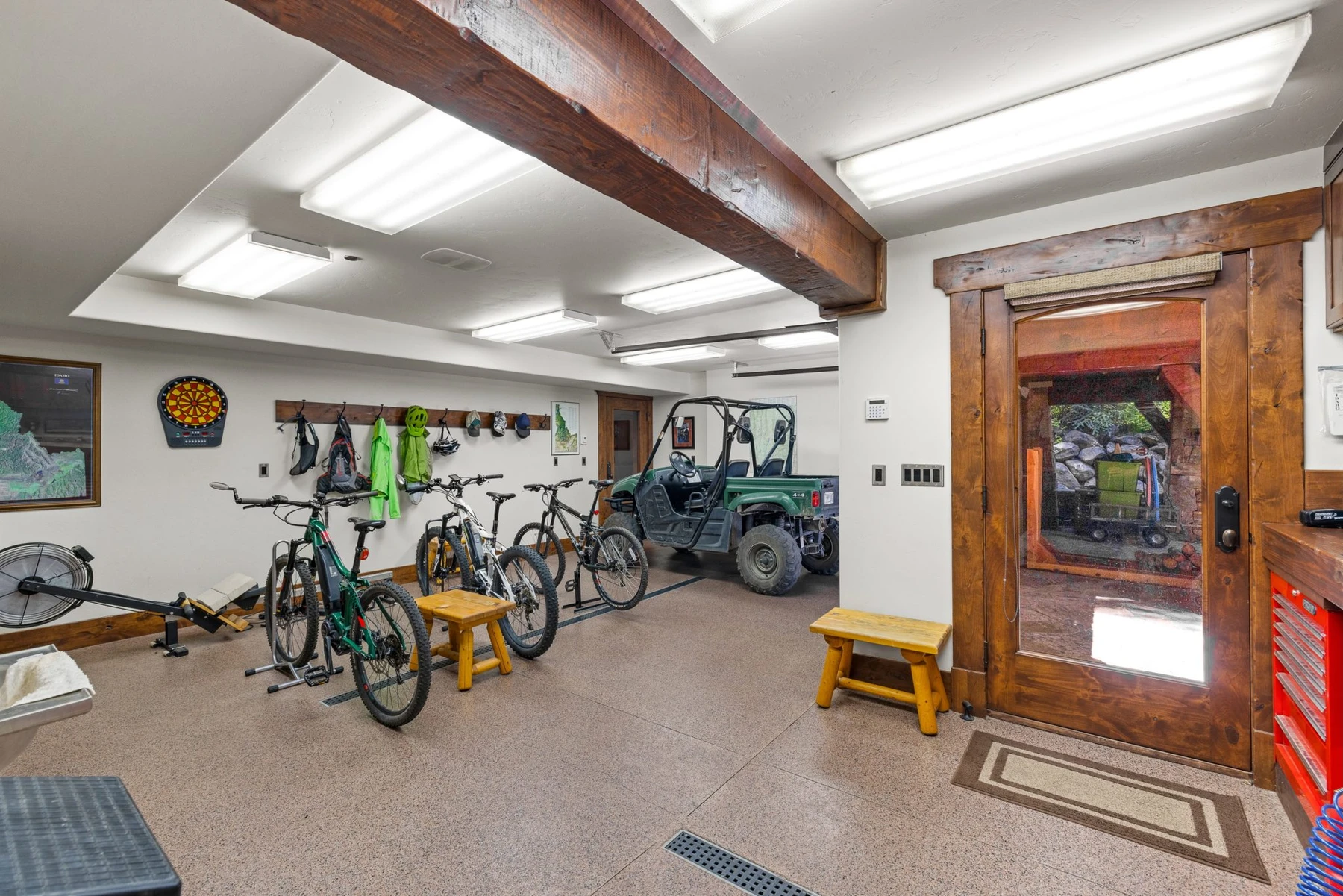 Gear room in the Rocky Shore lakefront home on Payette Lake, with bicycle storage and glass doors.