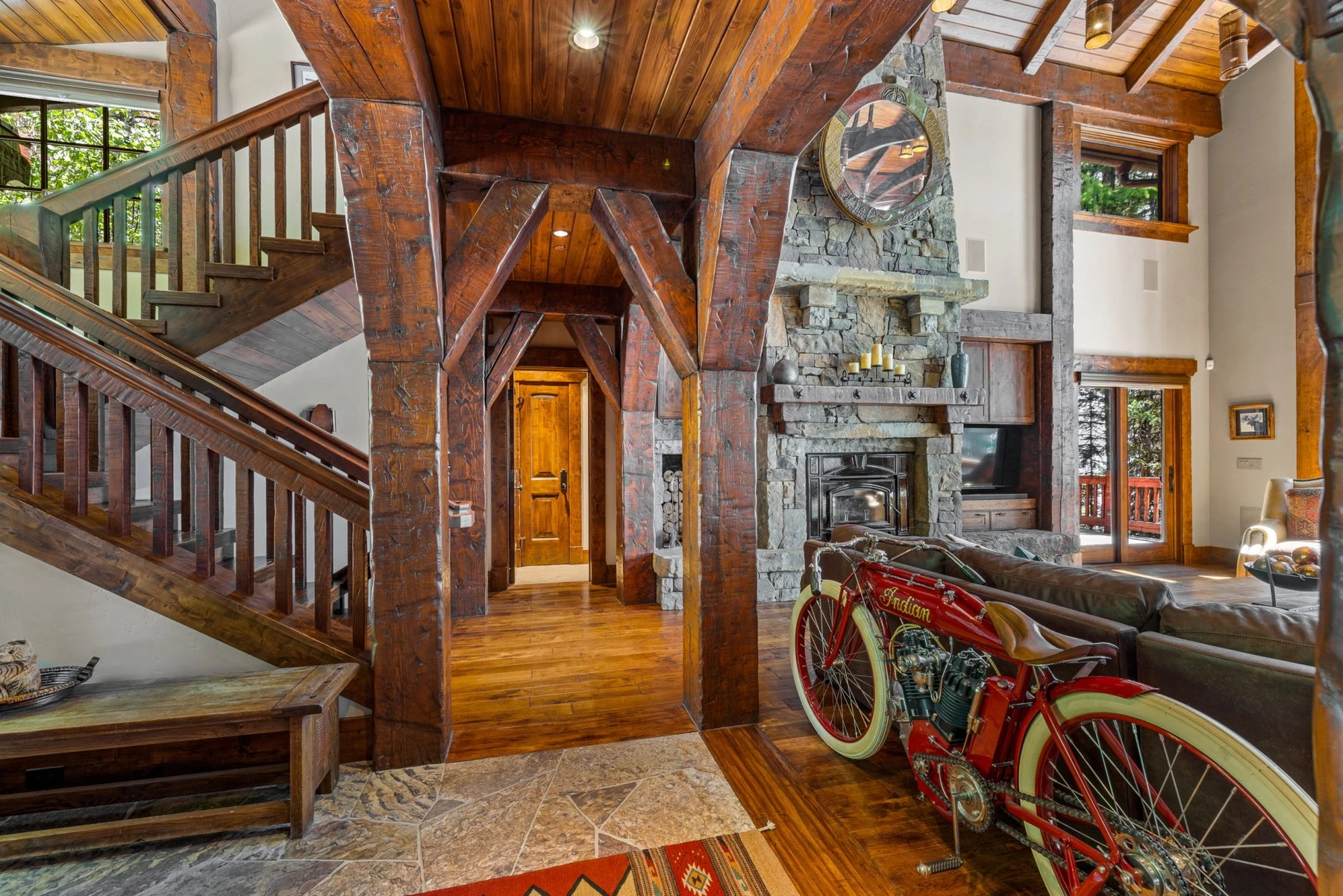 Gear room in the Rocky Shore lakefront home on Payette Lake, with bicycle storage and glass doors.