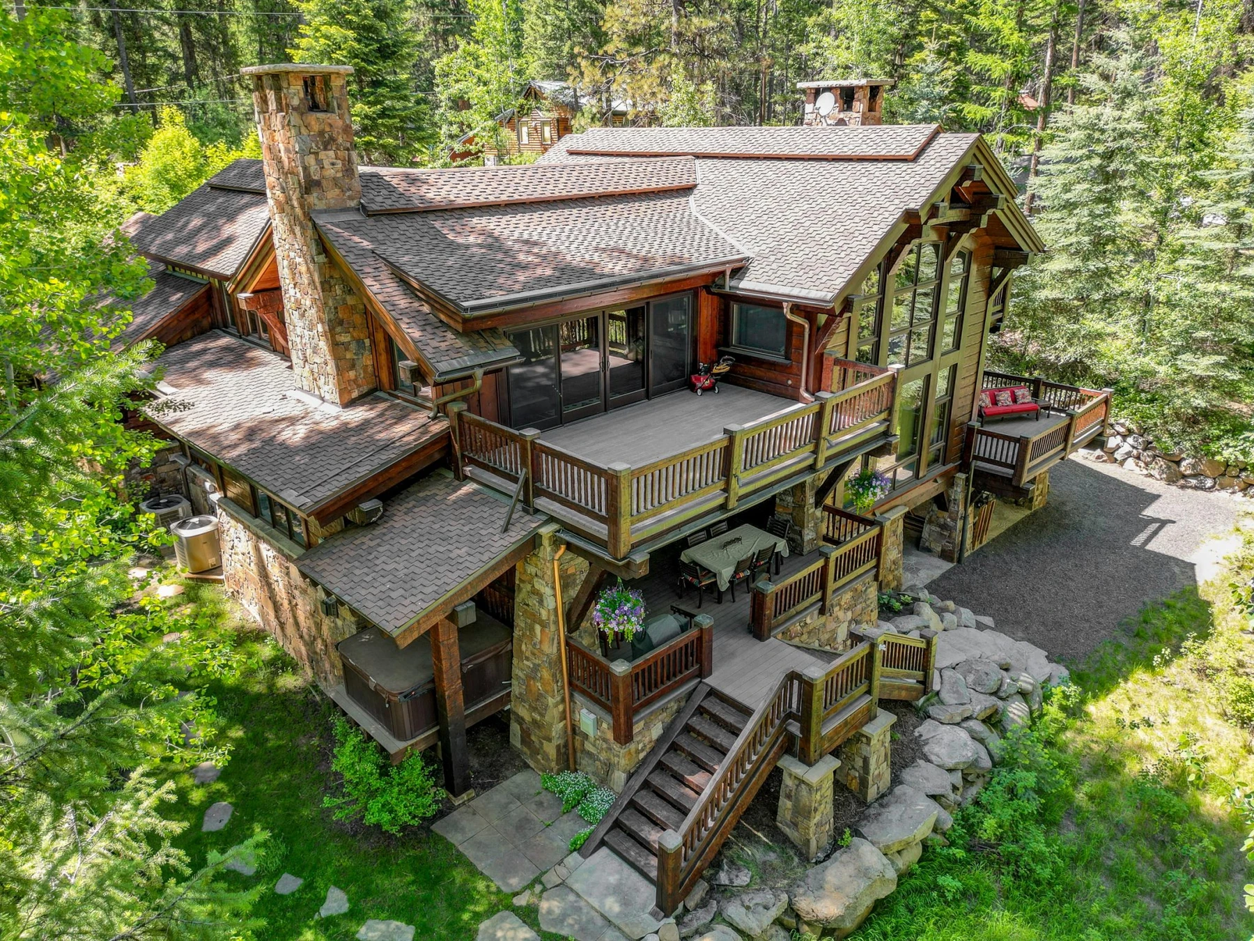 Aerial view of the Rocky Shore lakefront home on Payette Lake, showing the surrounding forest.