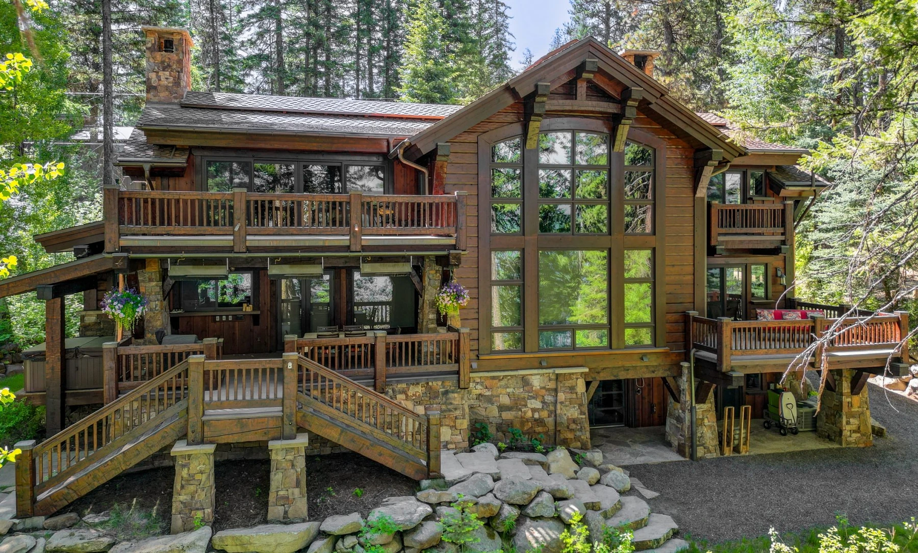 Aerial view of the Rocky Shore lakefront home on Payette Lake, showing the surrounding forest.