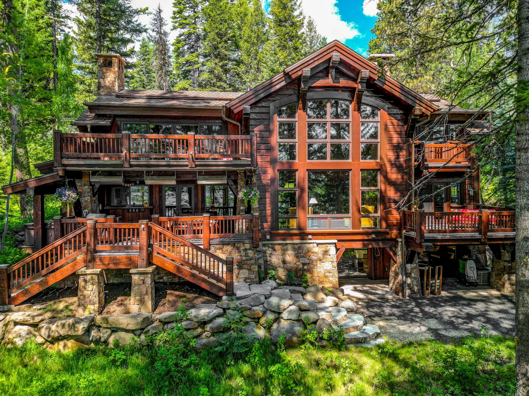 Aerial view of the Rocky Shore lakefront home on Payette Lake, showing the surrounding forest.