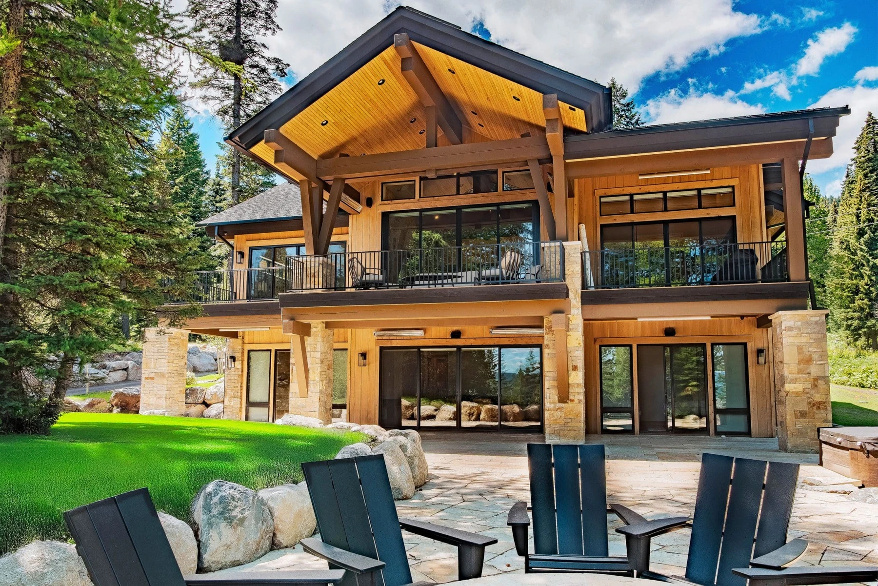 SlopeSide Escape: back-of-home view to the trees from the timber-framed deck