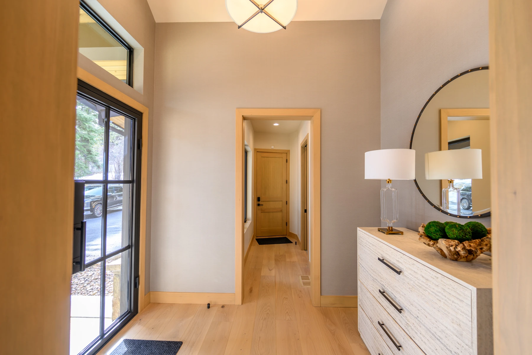 Interior detail in the SlopeSide Escape ski home at Tamarack Resort, showing built-in cabinetry, large windows, and wood finishes.
