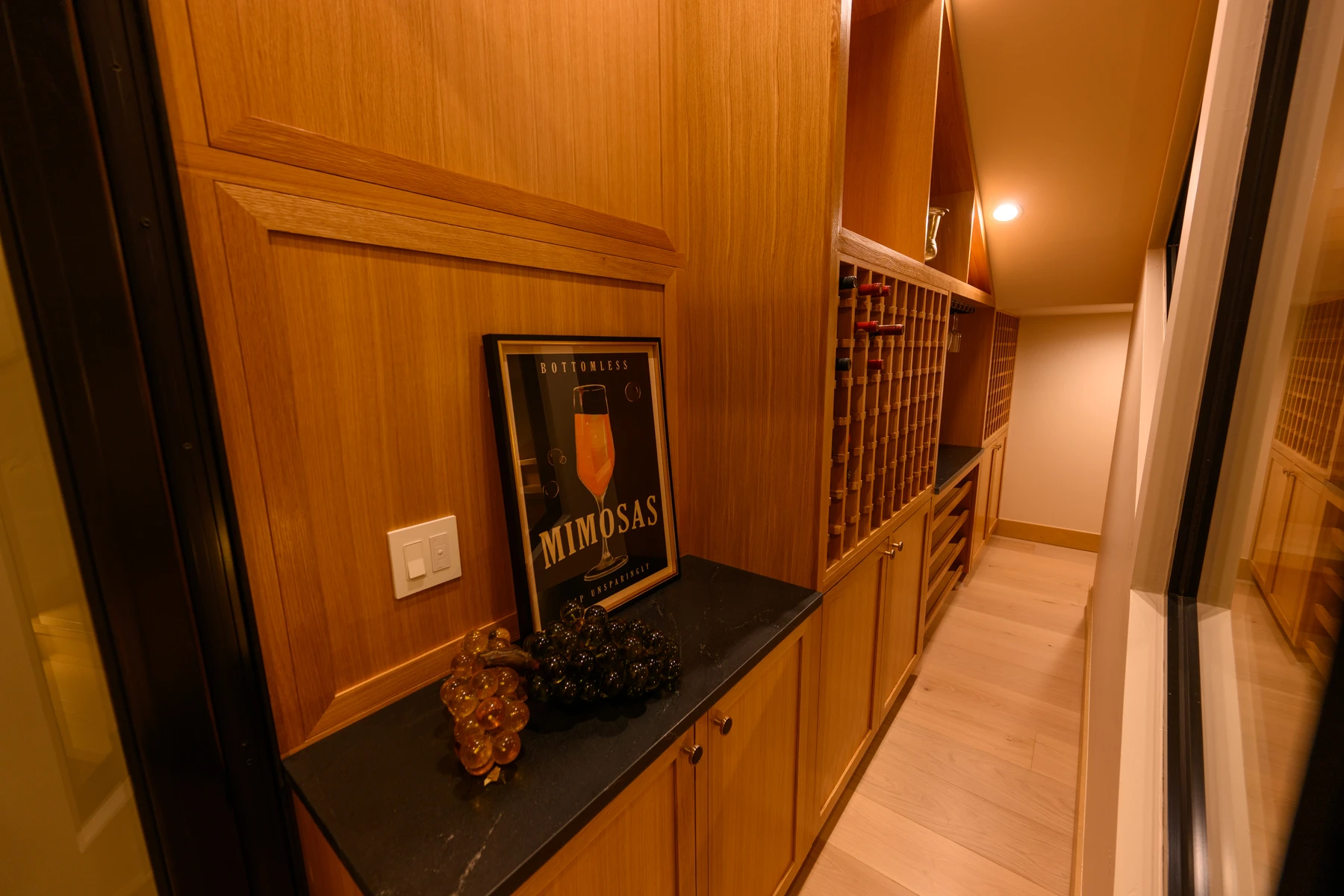 Interior detail in the SlopeSide Escape ski home at Tamarack Resort, showing built-in cabinetry, wood finishes, and framed artwork.
