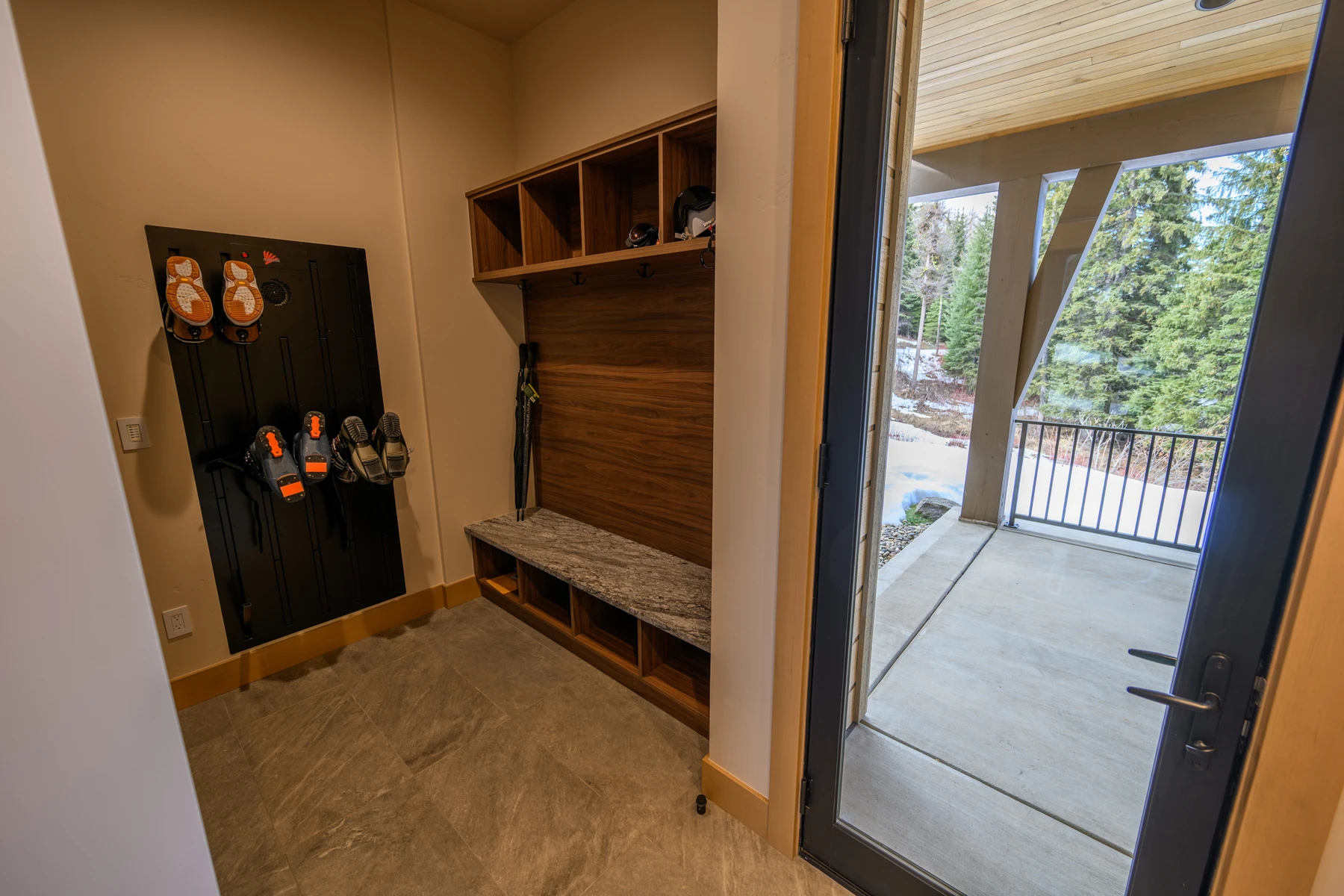 Dressing room in the SlopeSide Escape ski home at Tamarack Resort, with built-in storage and wood cabinetry.