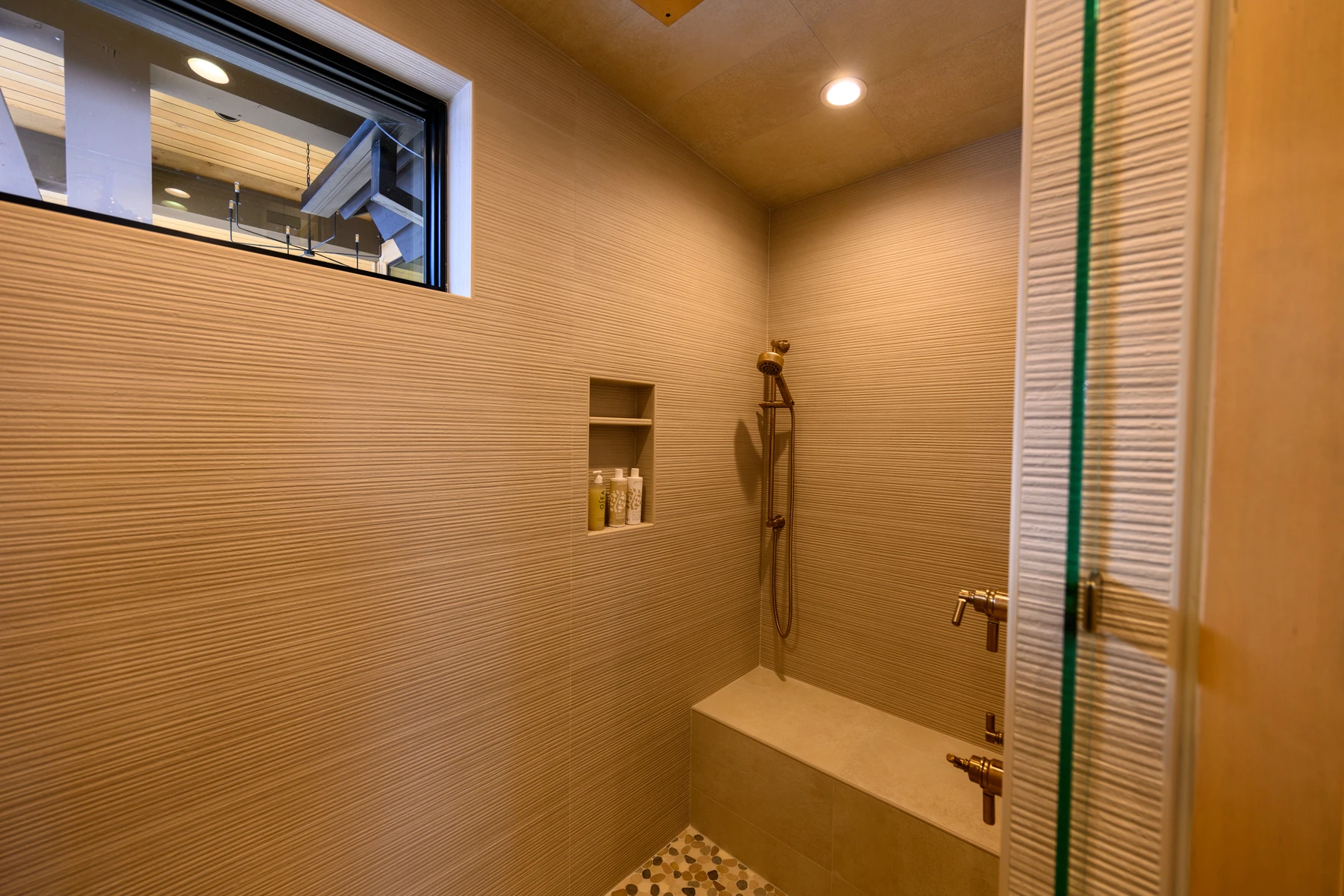 Bathroom in the SlopeSide Escape ski home at Tamarack Resort, with a glass shower.