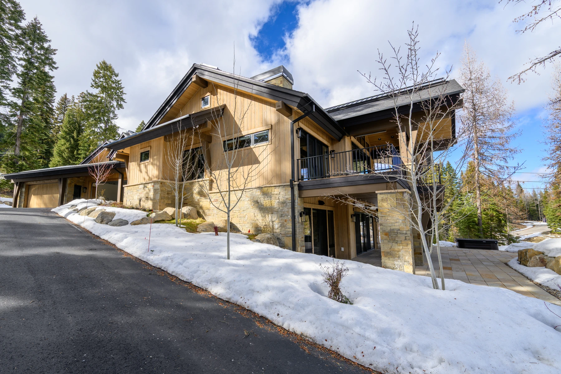 Garage approach at the SlopeSide Escape ski home at Tamarack Resort, with an attached garage and a snow-covered approach.