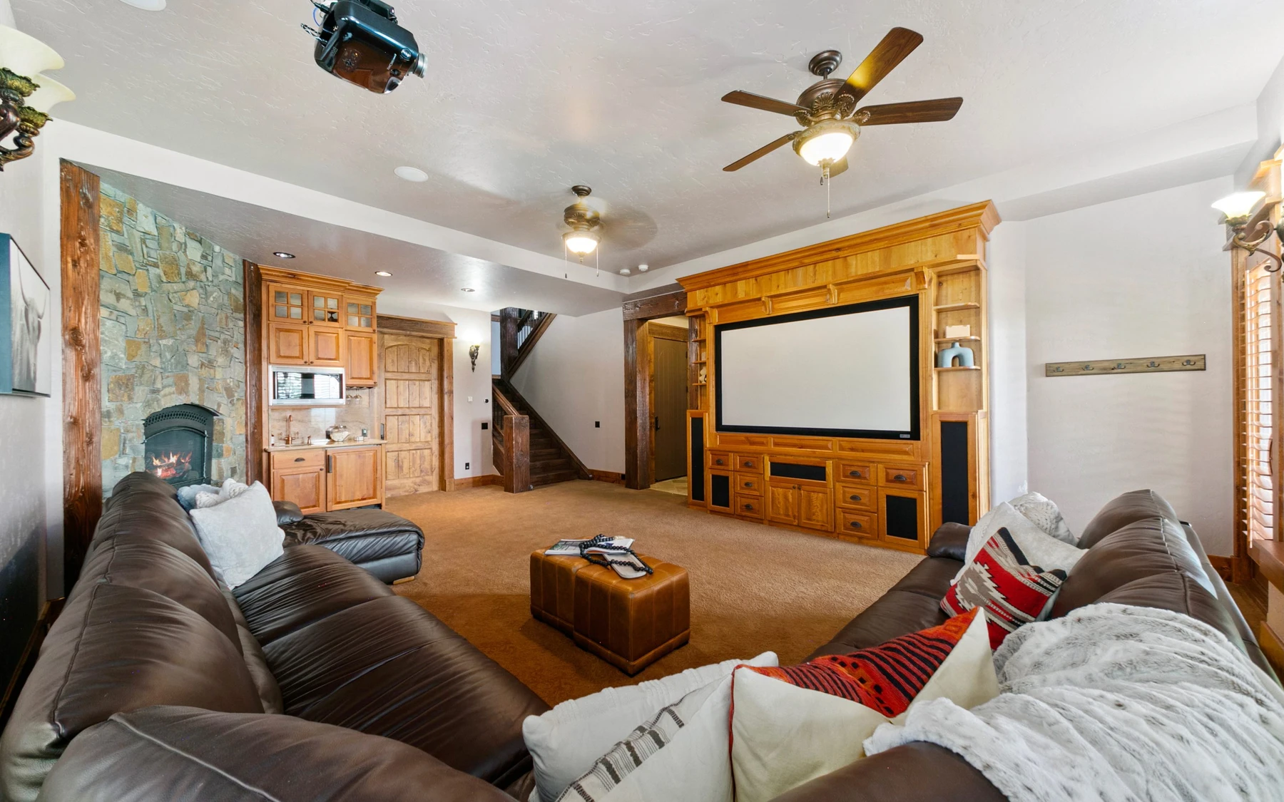 Living room in the Summit Sanctuary ridgeline home near McCall, with a relaxed seating area and warm wood finishes.