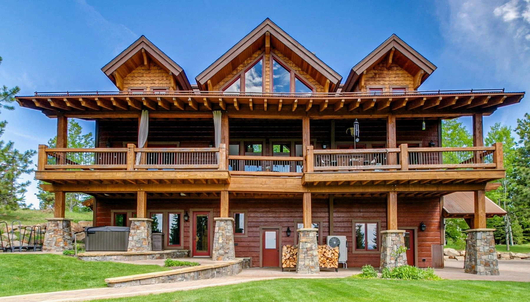 Covered entry at the Summit Sanctuary ridgeline home near McCall, framed by the exterior roofline.